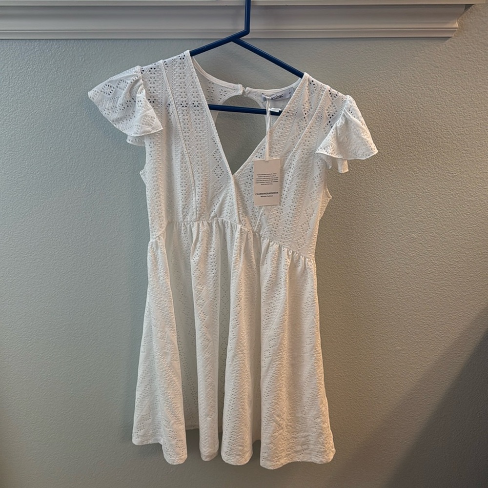 Brand new white cover up eyelet material to keep you cool. Size small